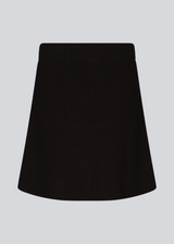 Knitted mini skirt in black in an A-line silhouette with a high waist with covered elasticated. GalenMD skirt is made of organic cotton. 