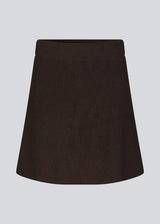 Knitted mini skirt in an A-line silhouette with a high waist with covered elasticated. GalenMD skirt is made of organic cotton. The model is 175 cm and wears a size S/36.