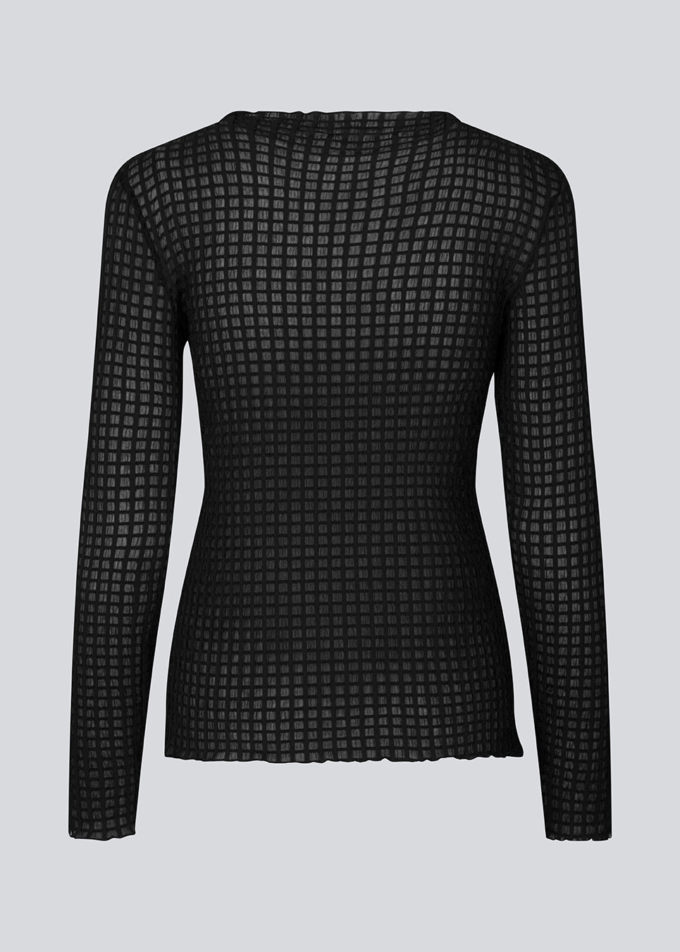 GeniferMD top is made in a slightly transparent quality with a tight fit. The top has long sleeves and a semi-high neckline with lettuce hems.