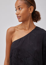 Top in shiny jacquard satin. GraceyMD top is designed with one bare shoulder and one long, wide sleeve. The fit is loose. The model is 175 cm and wears a size S/36.