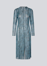Mesh dress with a high neck, long sleeves and midi length. GwenMD print dress has decorative lettuce hems on the body, neck and sleeves. The dress has a slit in front and is slightly transparent. The model is 175 cm and wears a size S/36.