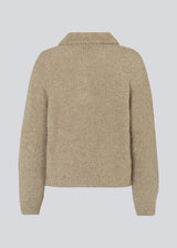 Knitted jumper made from a wool and alpaca blend. HardwickMD polo has a loose fit with collar and buttons in front, dropped shoulders, and long sleeves with a smaller, ribbed cuff. The model is 175 cm and wears a size S/36.