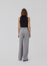 HarperMD top in black has a figure-hugging fit in a thin, soft jersey with a high, round neck. Sleeveless. The model is 175 cm and wears a size S/36.