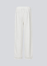 HattieMD pants in white are made from a transparent lace material. The pants have a loose fit with straight legs and a medium elasticated waist. Lined. The model is 175 cm and wears a size S/36.