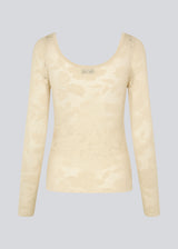 Tight-fitting top in beige in a stretchy lace material, that is slightly see-through. HawkinsMD top has long sleeves, and a deep neckline in front and back.