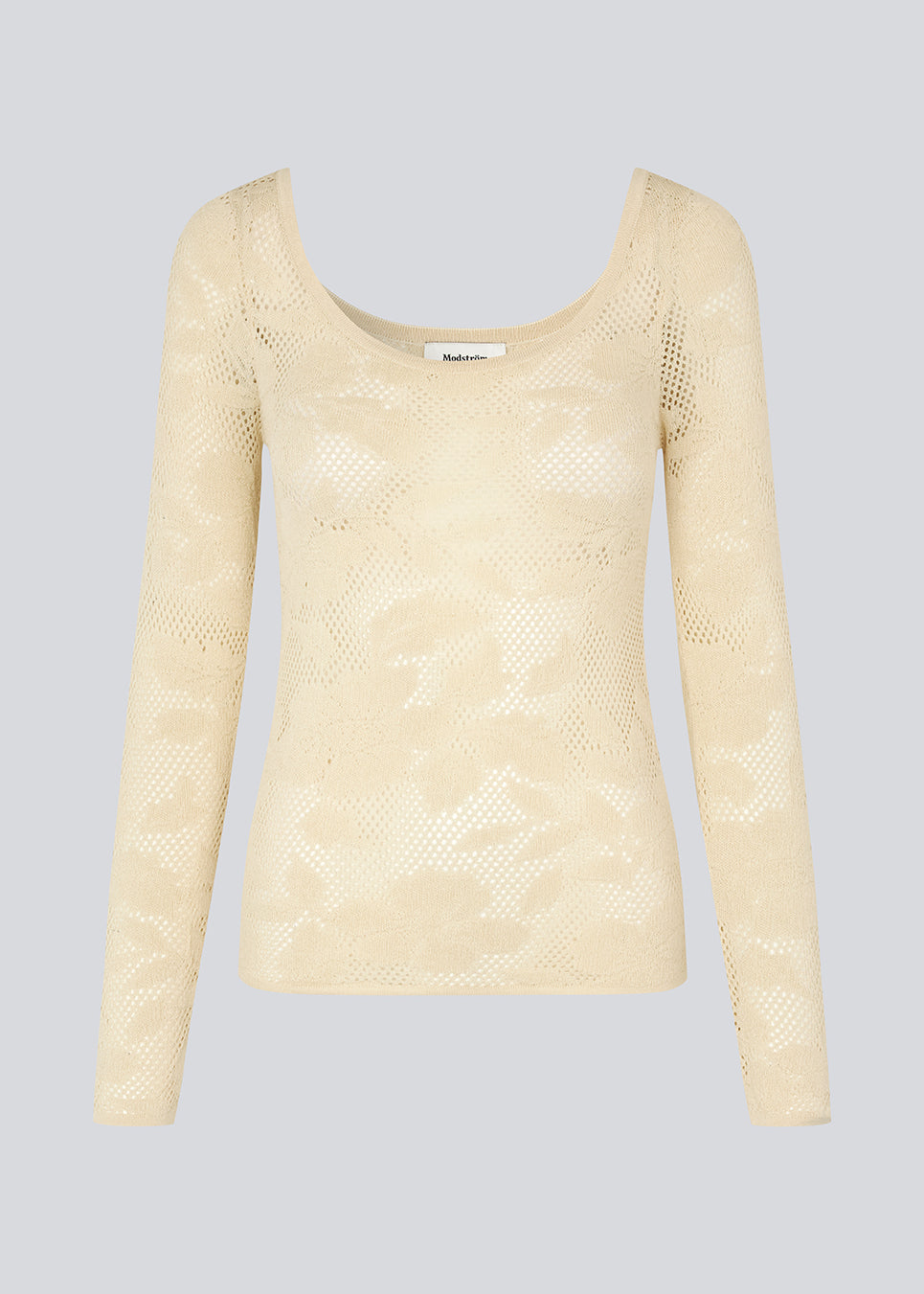 Tight-fitting top in beige in a stretchy lace material, that is slightly see-through. HawkinsMD top has long sleeves, and a deep neckline in front and back.
