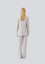 High-waisted pants in a woven quality with zip fly with hidden hook and bar closure. HeartMD pants has slanted side pockets and faux welt pockets in the back. Straight legs. The model is 175 cm and wears a size S/36.