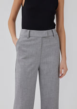 High-waisted pants in a woven quality with zip fly with hidden hook and bar closure. HeartMD pants has slanted side pockets and faux welt pockets in the back. Straight legs. The model is 175 cm and wears a size S/36.