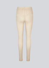 Tights with a snug silhouette in a transparent, patterned quality. HendrickMD tights has a high, elasticated waist. The model is 175 cm and wears a size S/36.