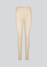 Tights with a snug silhouette in a transparent, patterned quality. HendrickMD tights has a high, elasticated waist. The model is 175 cm and wears a size S/36.