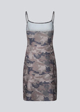 Modern printed strap dress. HimaMD print strap dress is a versatile design featuring a cool camouflage print, slim straps, and a clean, straight silhouette. It can be styled on its own or layered over trousers for a cool, fashion-forward look.