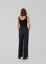 Black top with wide straps and stretch in recycled quality. HimaMD top has tight-fitted silhouette with chest reinforcement.