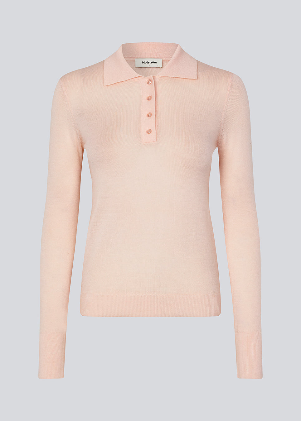 Fitted polo in a pink pale color made in a soft wool. HirokiMD polo has long, shirtcollar and buttonclosure.