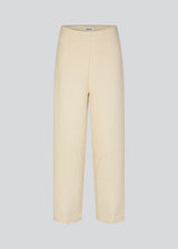 Pants with straight legs in a structured material. HollisMD pants have a medium waist with hidden zipper at one side, and two welt pockets on the back. 