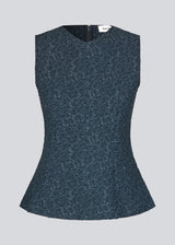 Tailored top in dark blue without sleeves made from a structured material. HollisMD top has a high v-shaped neckline with a hidden zipper at the neck. 