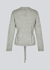 Loose knitted cardigan in 100% mercerized wool. HowieMD cardigan has a tie band in the waist and long loose sleeves.