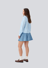 Shirt in a light EcoVero viscose with a loose fit. HudgesMD shirt has a collar, button closure in front, and long sleeves with cuff.