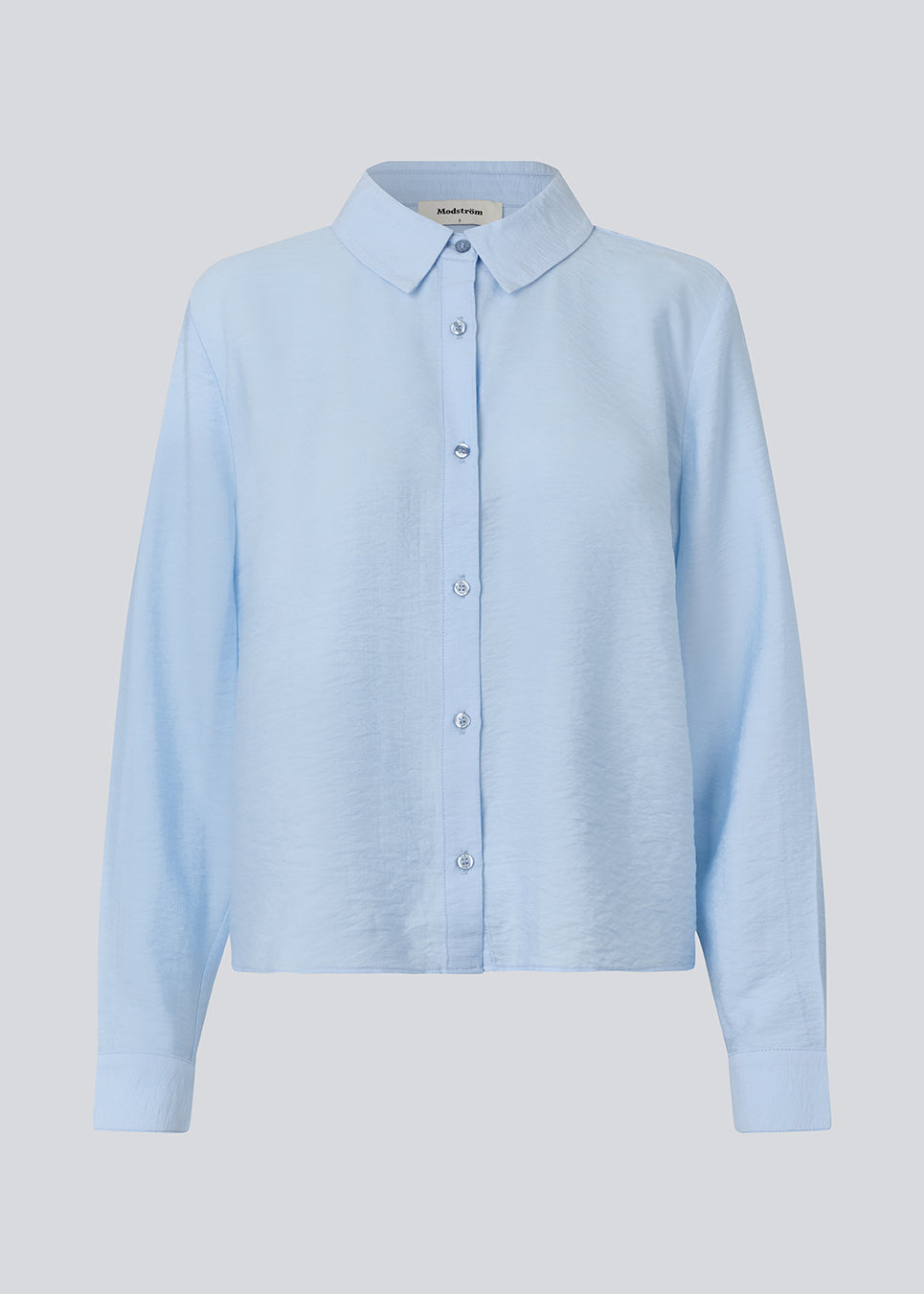 Shirt in a light EcoVero viscose with a loose fit. HudgesMD shirt has a collar, button closure in front, and long sleeves with cuff.