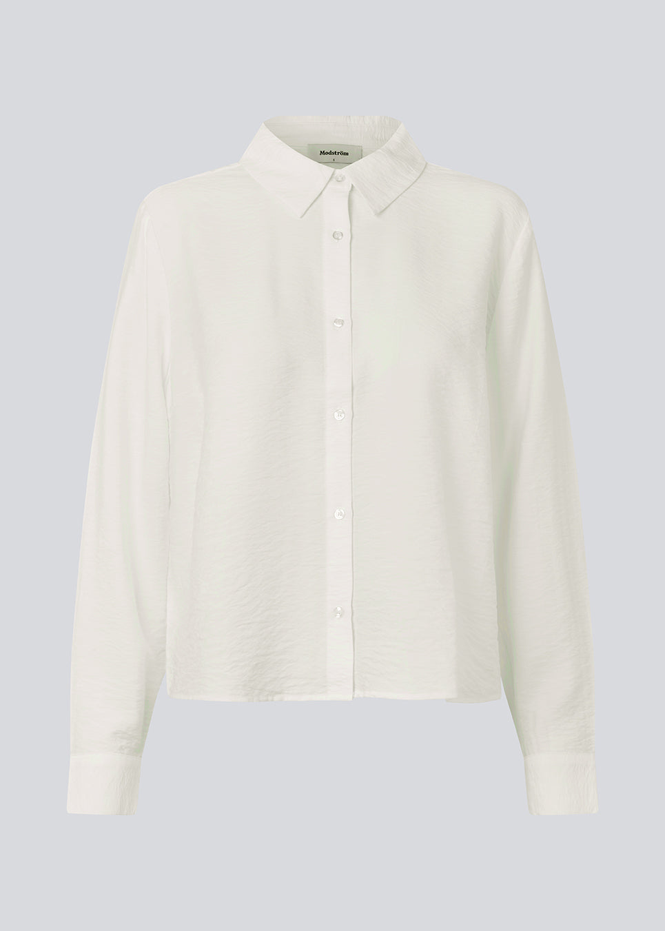 Shirt in a light EcoVero viscose with a loose fit. HudgesMD shirt has a collar, button closure in front, and long sleeves with cuff.