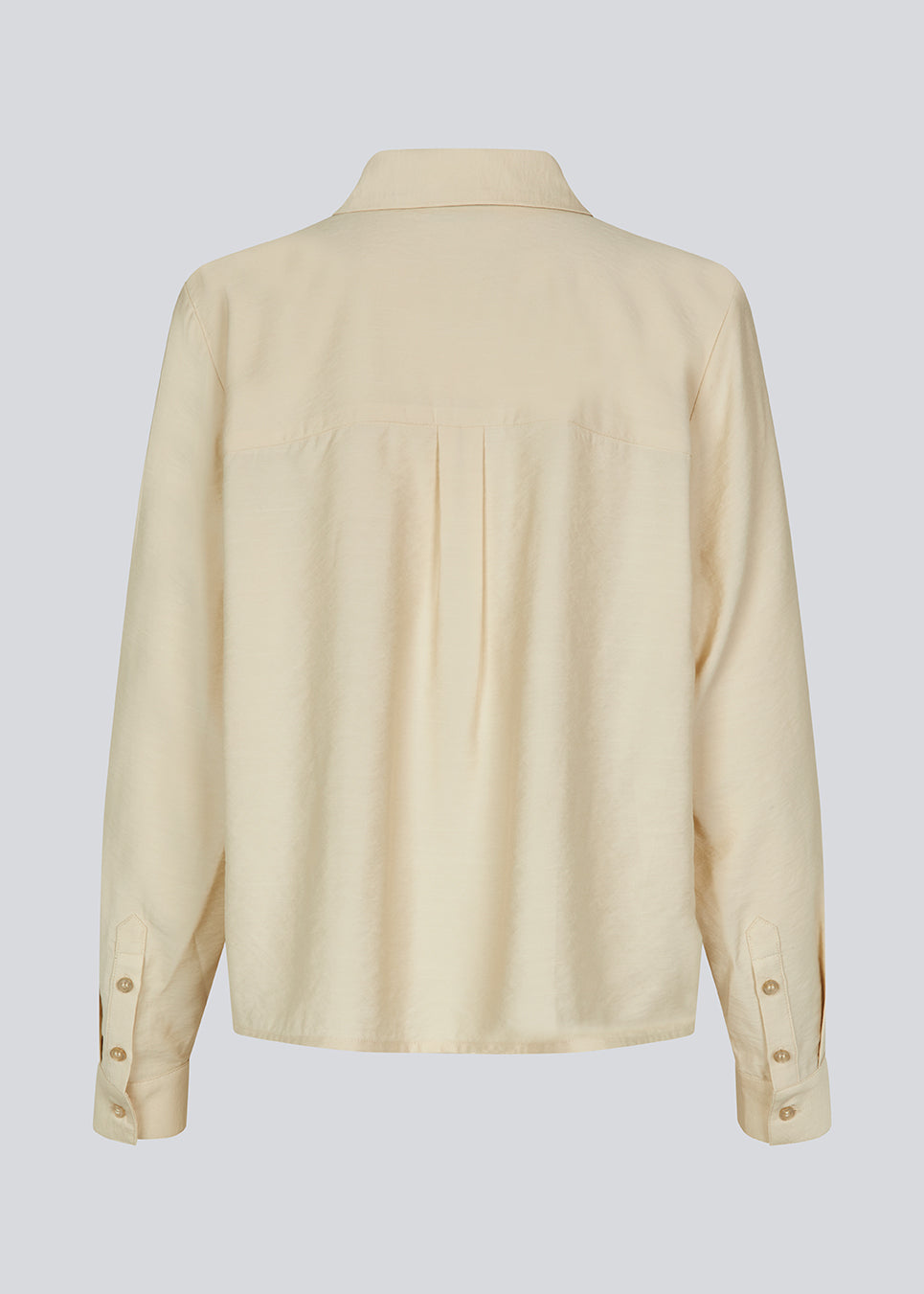Shirt in beige in a light EcoVero viscose with a loose fit. HudgesMD shirt has a collar, button closure in front, and long sleeves with cuff. 