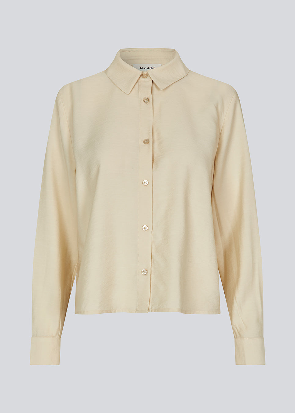 Shirt in beige in a light EcoVero viscose with a loose fit. HudgesMD shirt has a collar, button closure in front, and long sleeves with cuff. 