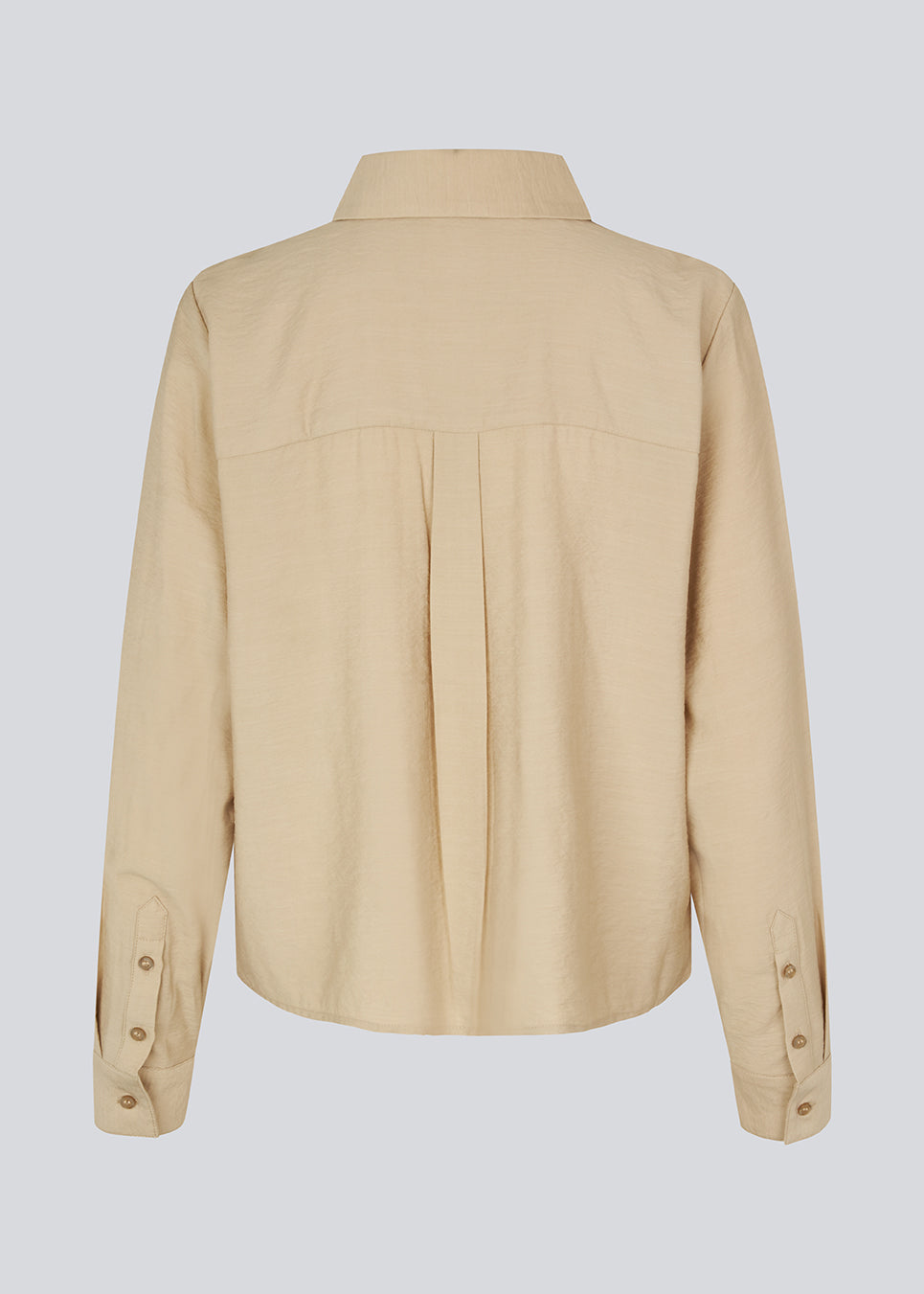 Shirt in beige in a light EcoVero viscose with a loose fit. HudgesMD shirt has a collar, button closure in front, and long sleeves with cuff. 