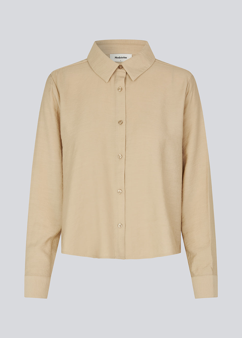Shirt in beige in a light EcoVero viscose with a loose fit. HudgesMD shirt has a collar, button closure in front, and long sleeves with cuff. 