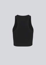 Basic top cut from a soft ribbed jersey fabric. IgorMD crop top in the color Black is styles with a slim fit and cropped fit with racer-shaped back. Perfect for a sporty look. The model is 173 cm and wears a size S/36