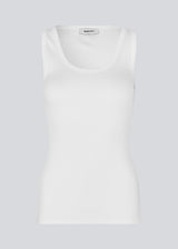 Sleeveless white top in ribbed cotton jersey. Igormd tank top has a thight fit and a round neckline. fit with long sleeves.