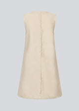 Short sleeveless dress in linen and cotton. IngridMD dress has a v-neckline and raw edges in front and at the bottom.<br>