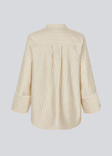 Shirt with copped sleeves and a slit. IsabelMD shirt has a hidden button closure and a high neck.