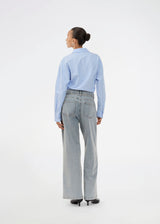 Jeans with wide legs in cotton denim in a light blue wash. IsoldeMD pants have a high waist, front and back pockets and a tie band at the waist.