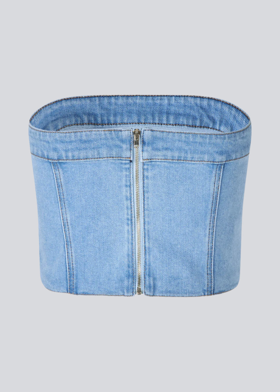Short denim top in a corset design. IvannaMD top in made in light colored denim and is closed with a zipper at the back.