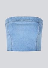 Short denim top in a corset design. IvannaMD top in made in light colored denim and is closed with a zipper at the back.