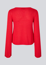 Knitted top with long flared sleeves and a wide neckline. IvonneMD o-neck has a normal fit.