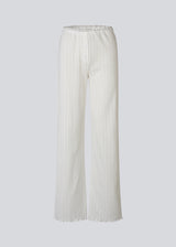 White pointelle pants. Josefinemd pants are feminine pointelle cotton trousers with lace trim and a subtle openwork pattern. Soft, comfortable, and ideal for relaxing at home. Josefine Vogt (165 cm) and the model (177 cm) are both wearing size Small.