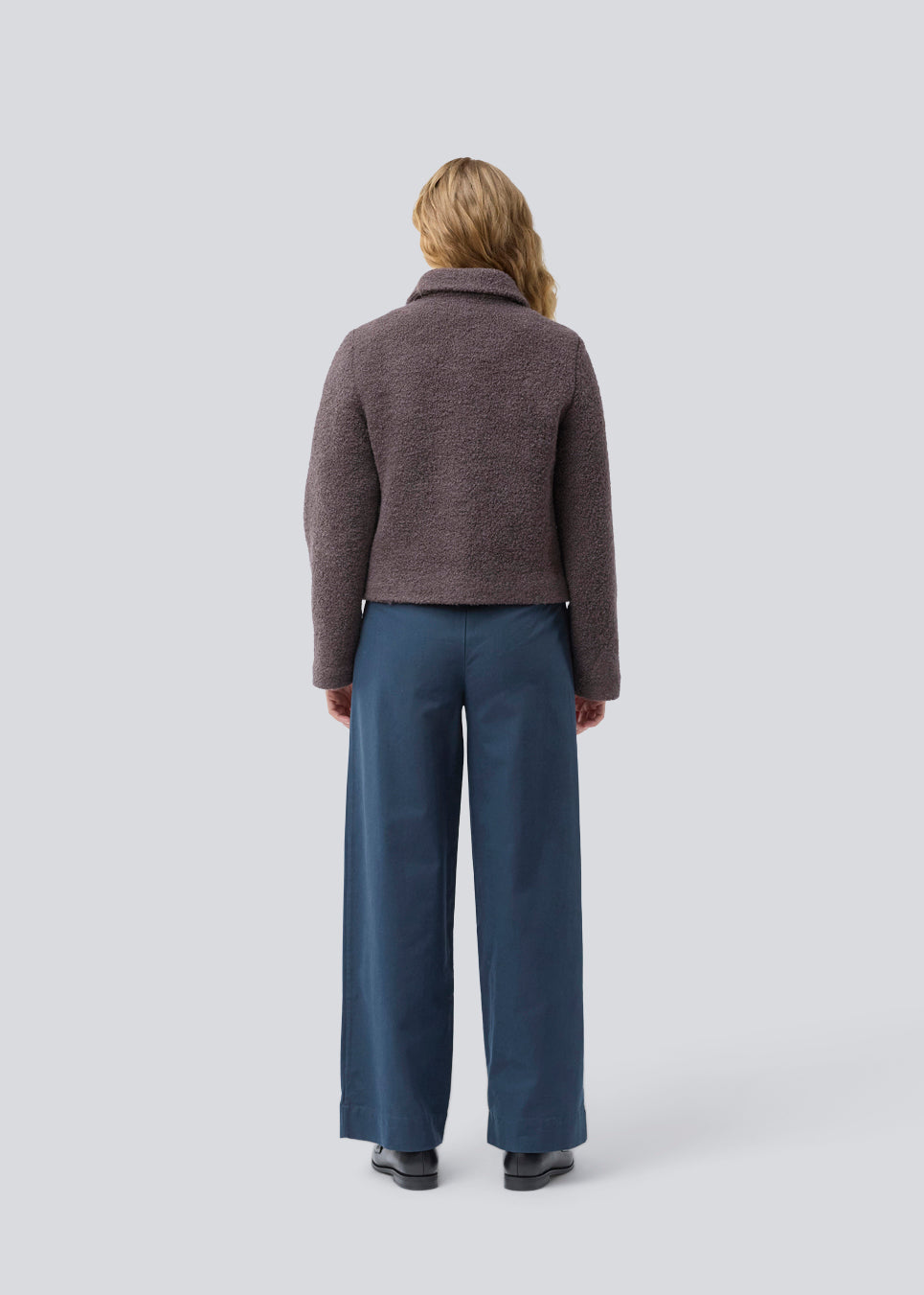 Short jacket in a wool mix. JustyMD short jacket has a loose fit, button closure and to pockets in front.