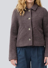 Short jacket in a wool mix. JustyMD short jacket has a loose fit, button closure and to pockets in front.