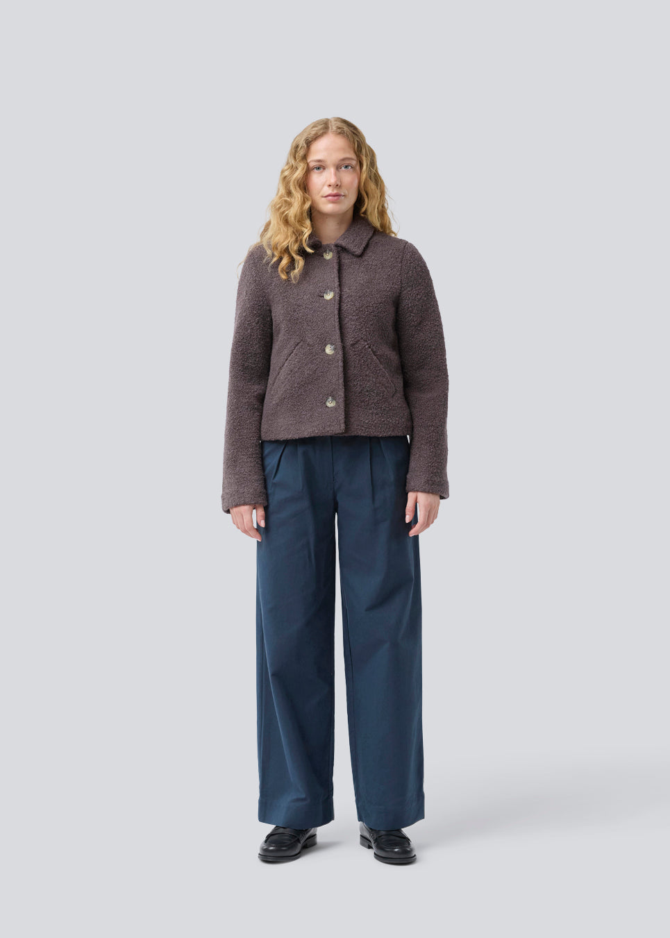 Short jacket in a wool mix. JustyMD short jacket has a loose fit, button closure and to pockets in front.