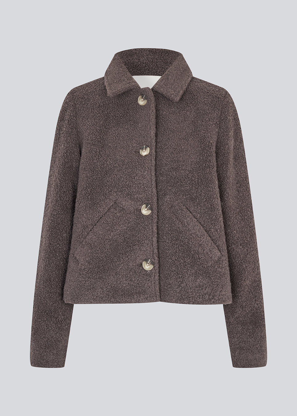 Short jacket in a wool mix. JustyMD short jacket has a loose fit, button closure and to pockets in front.