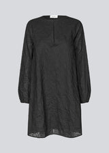 Short dress in embroidered cotton. KaidenMD dress has a classic A-line and an opening in front with a button closure.