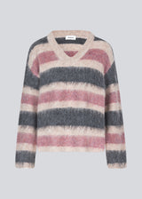 Soft knit with a V-neck. KaneMD v-neck has a loose fit and dropped shoulders.