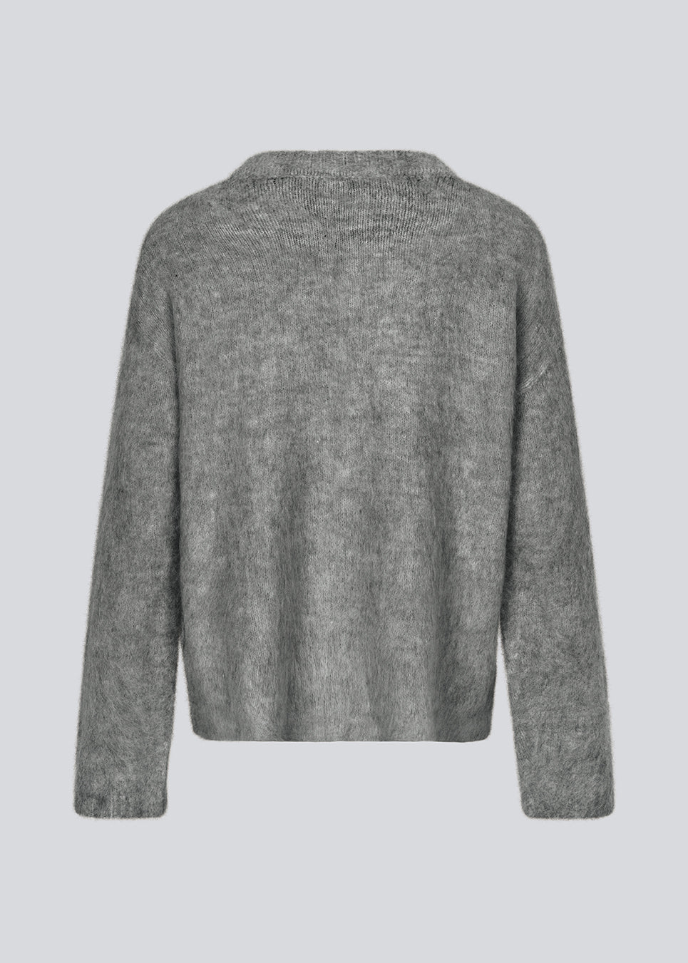 Soft knit in dark grey with a v-neck. KaneMD v-neck has a loose fit and dropped shoulders.