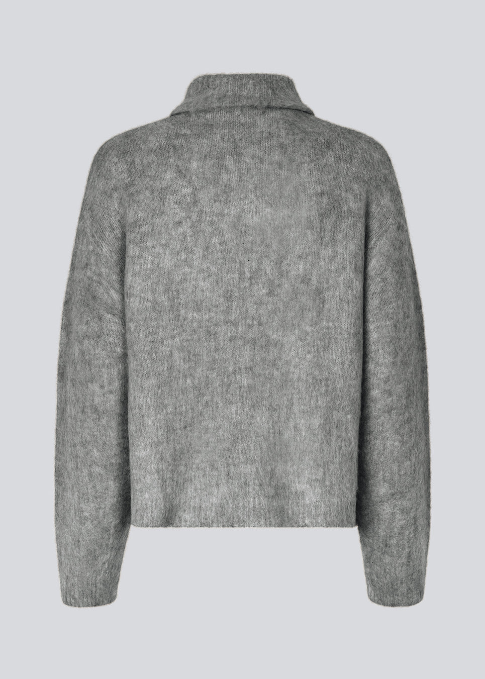 Soft grey knit with a high neck and half zip front. KaneMD v-neck has a loose fit and dropped shoulders.