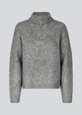 Soft grey knit with a high neck and half zip front. KaneMD v-neck has a loose fit and dropped shoulders.