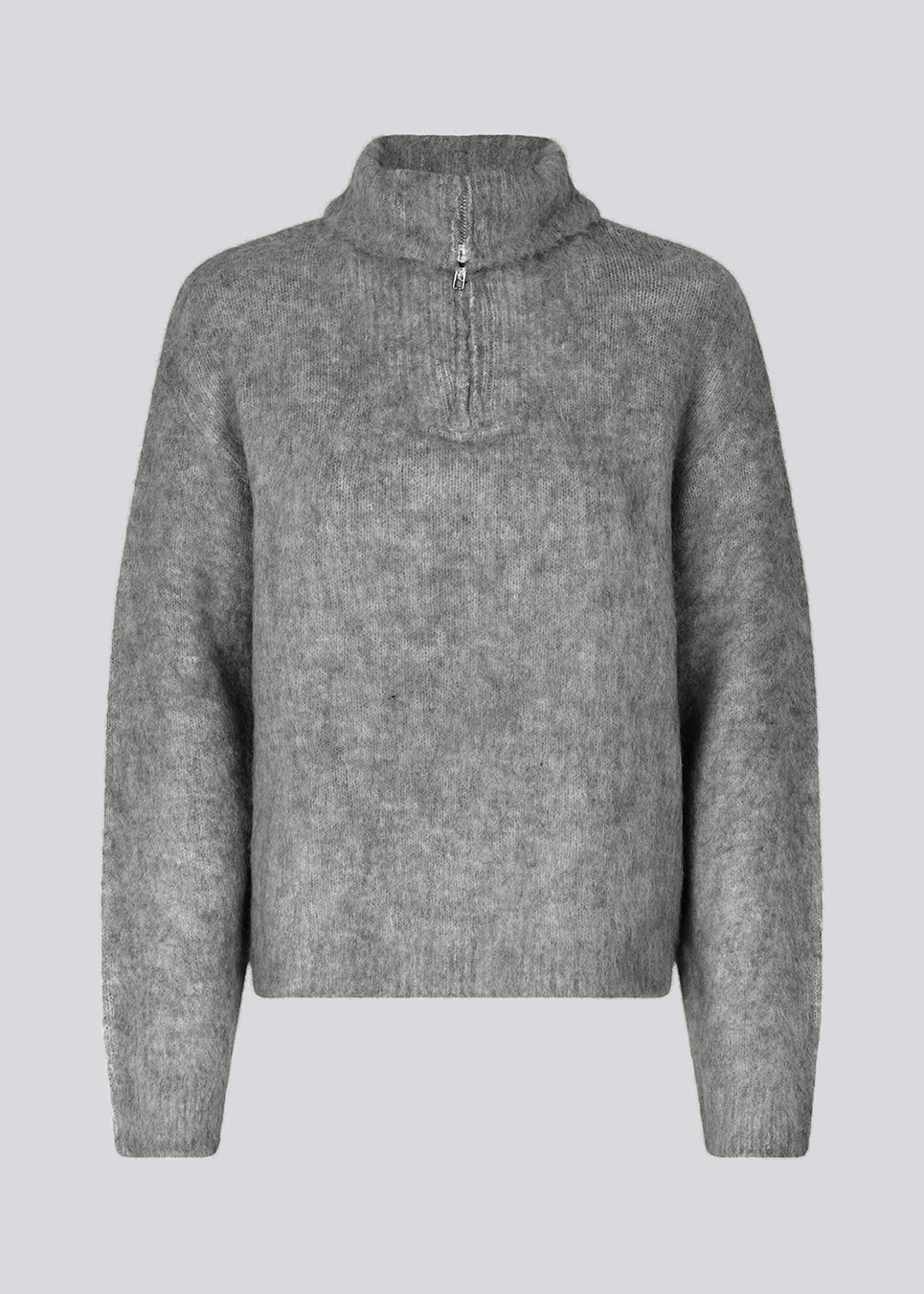 Soft grey knit with a high neck and half zip front. KaneMD v-neck has a loose fit and dropped shoulders.
