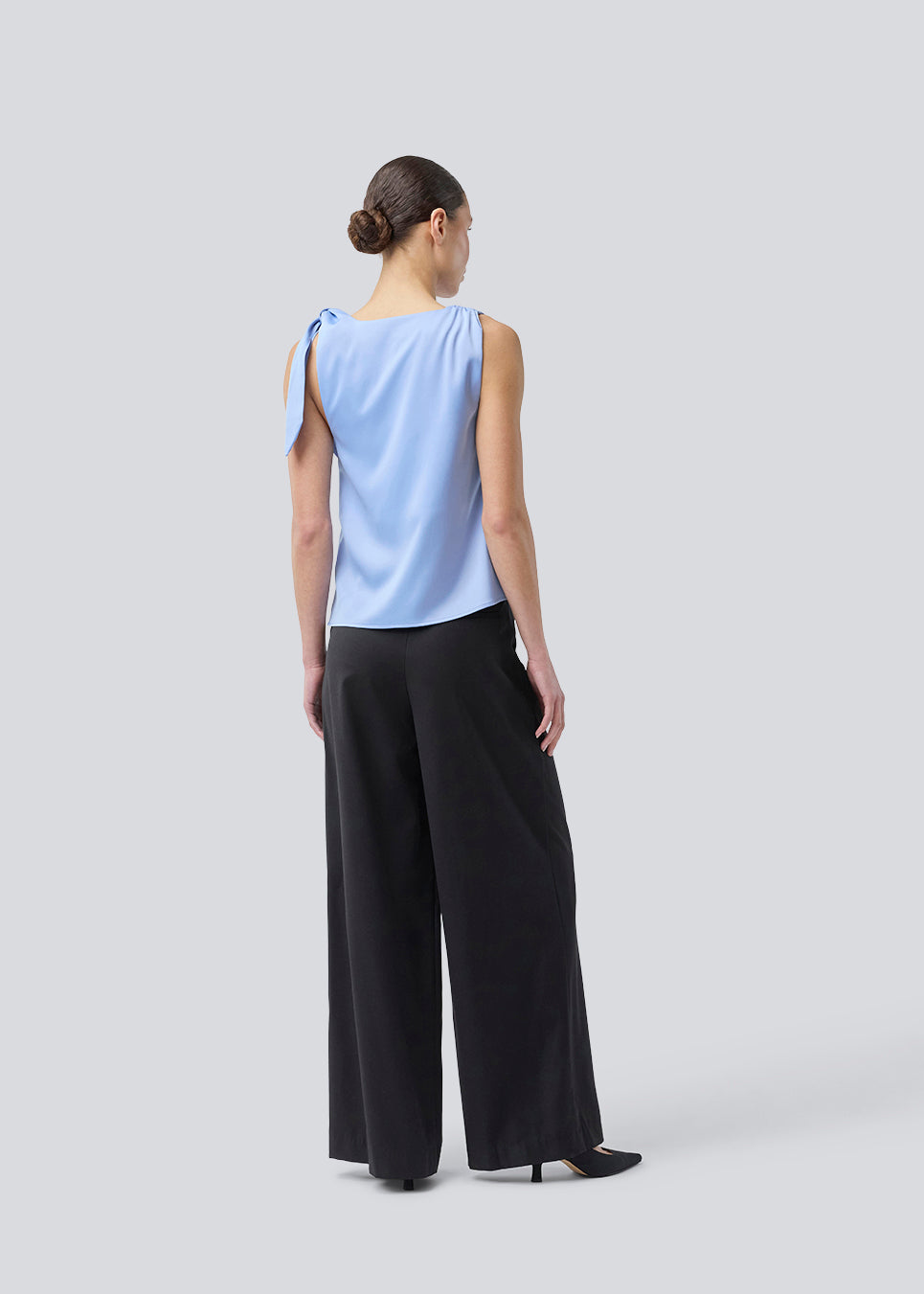 Satin top with waterfall detail at the neck. Katja MD top has a tie detail at the shoulder and a relaxed fit.