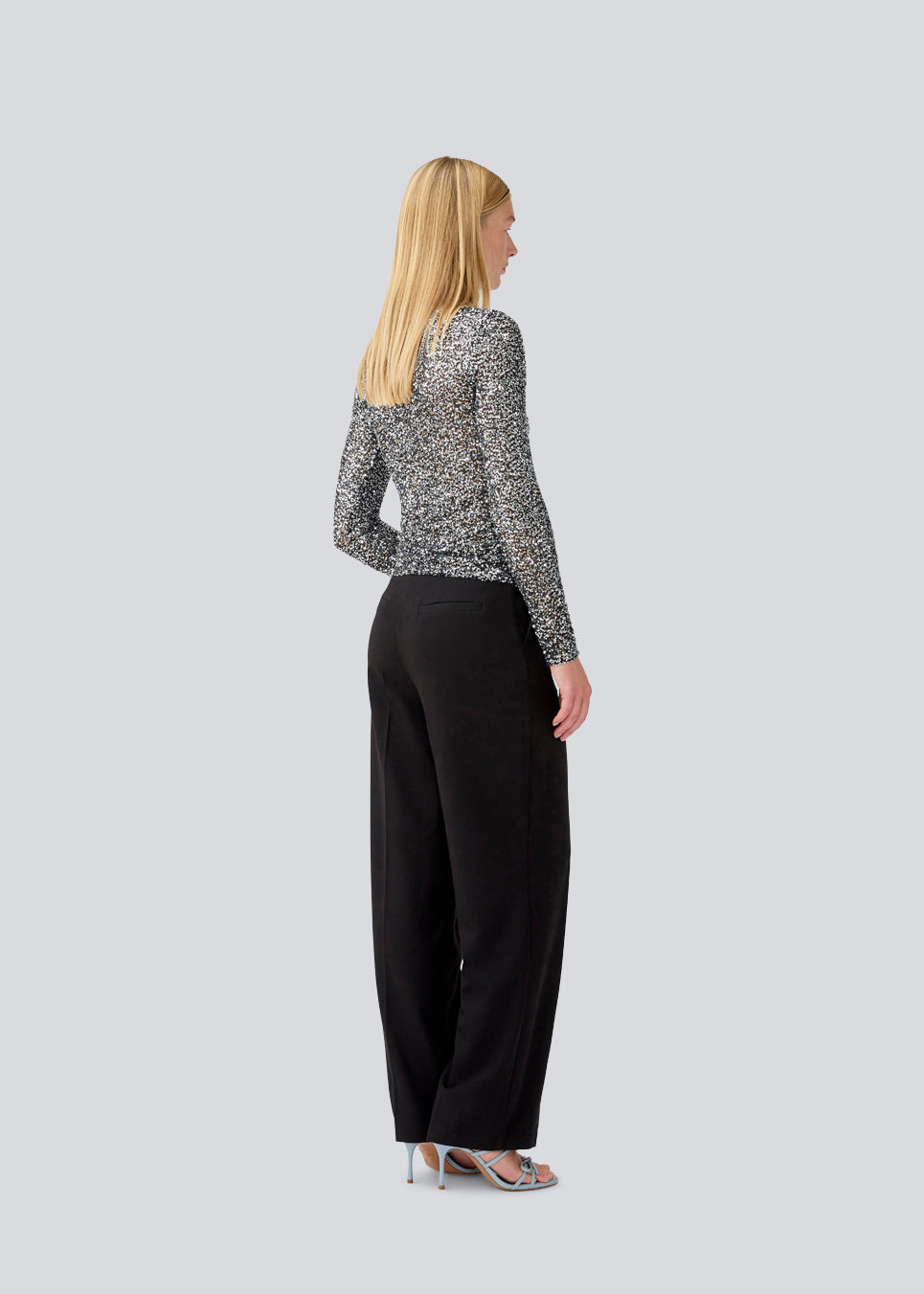 longsleeved top in silver sequence jersey. LaraMD top is fitted and has a round neck.