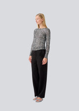 longsleeved top in silver sequence jersey. LaraMD top is fitted and has a round neck.