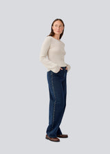 Classic jeans with wide legs and metal studs on the sides. LuccaMD jeans has a zipper, side pockets and two back pockets